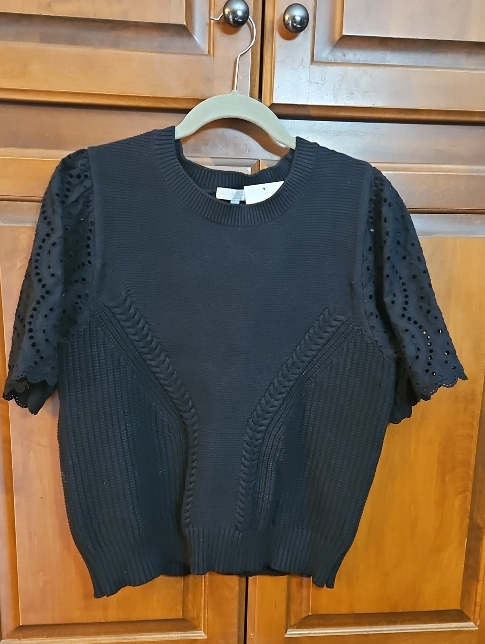 Stylish Black Short-Sleeve Knit Top with Eyelet Sleeves